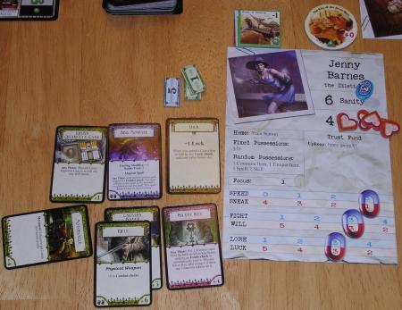 A character card with several tokens on it, surrounded by equipment cards